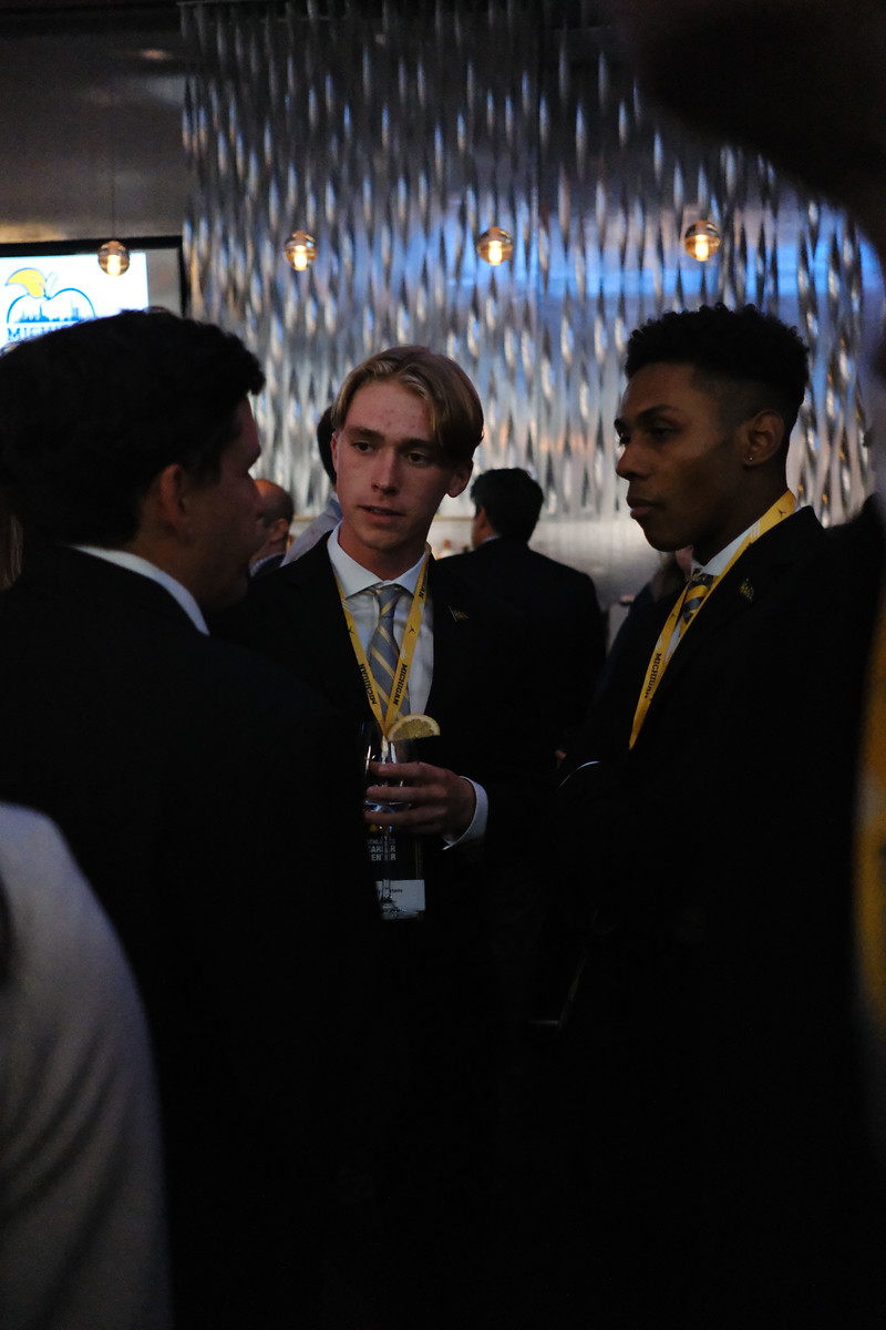 Guests talking together at an indoor event